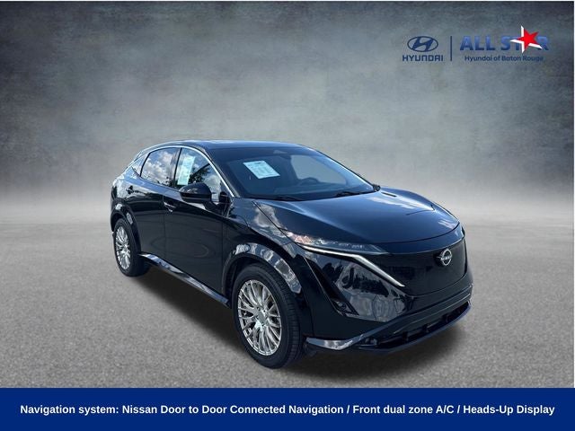2023 Nissan ARIYA EVOLVE+ in Black Diamond Pearl — front three-quarter view