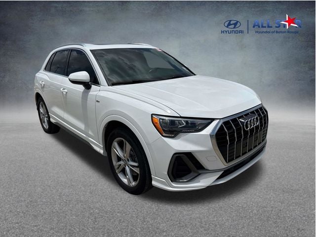 2020 Audi Q3 S line Premium in Ibis White — front three-quarter view